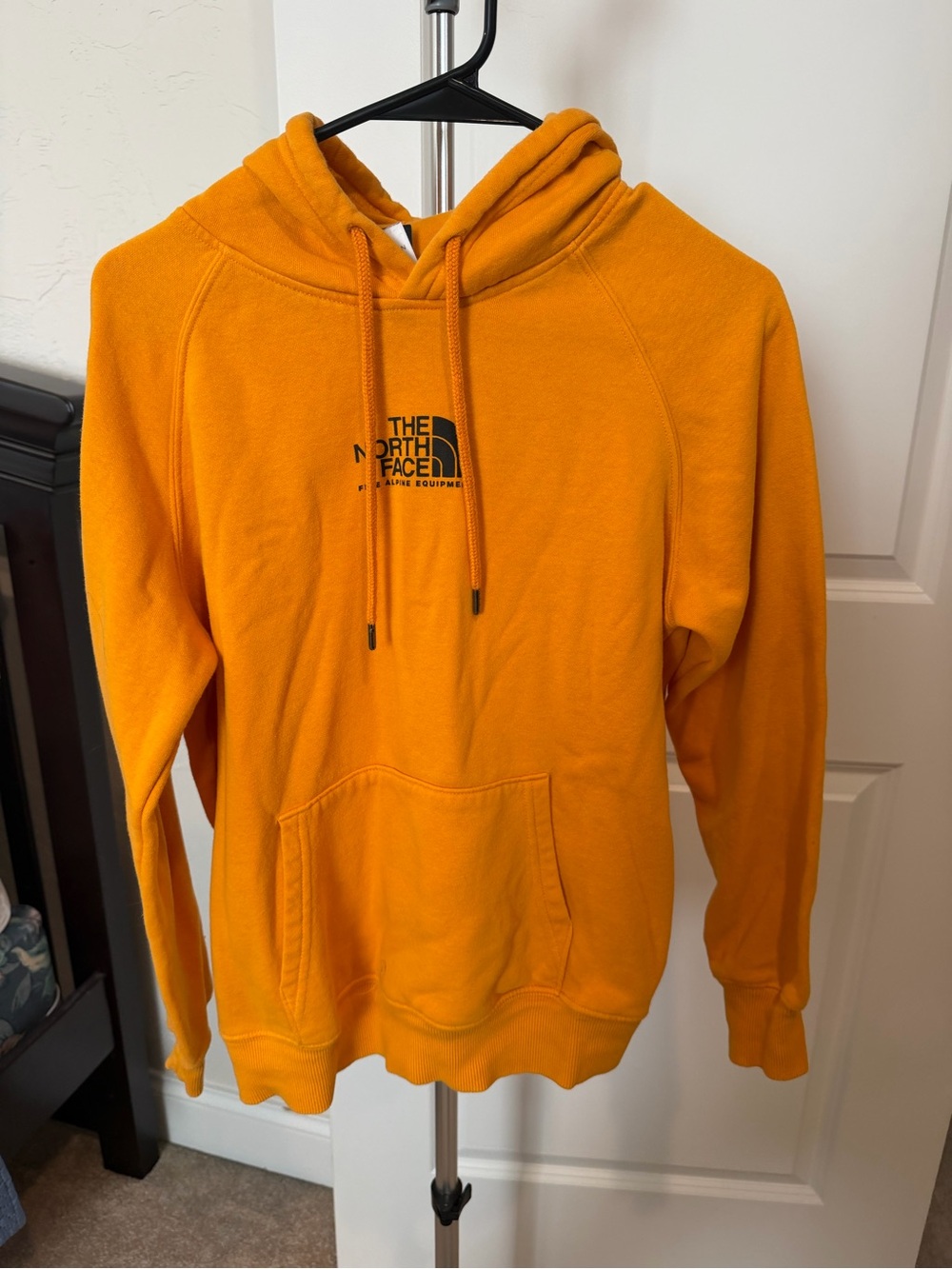 The North Face Orange Pullover Hoodie with Black Logo